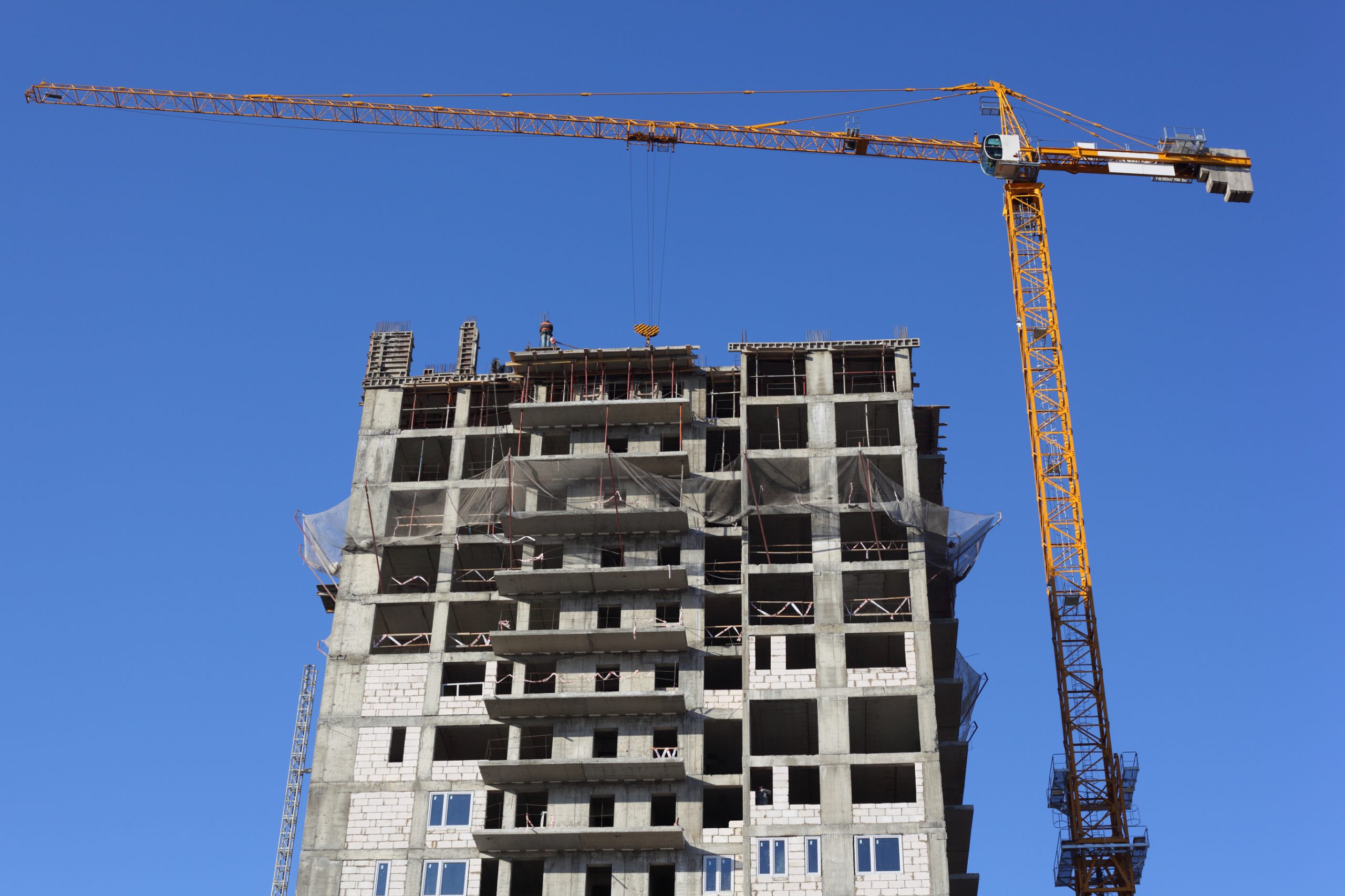 New market-rate apartment building under construction in an urban neighbourhood